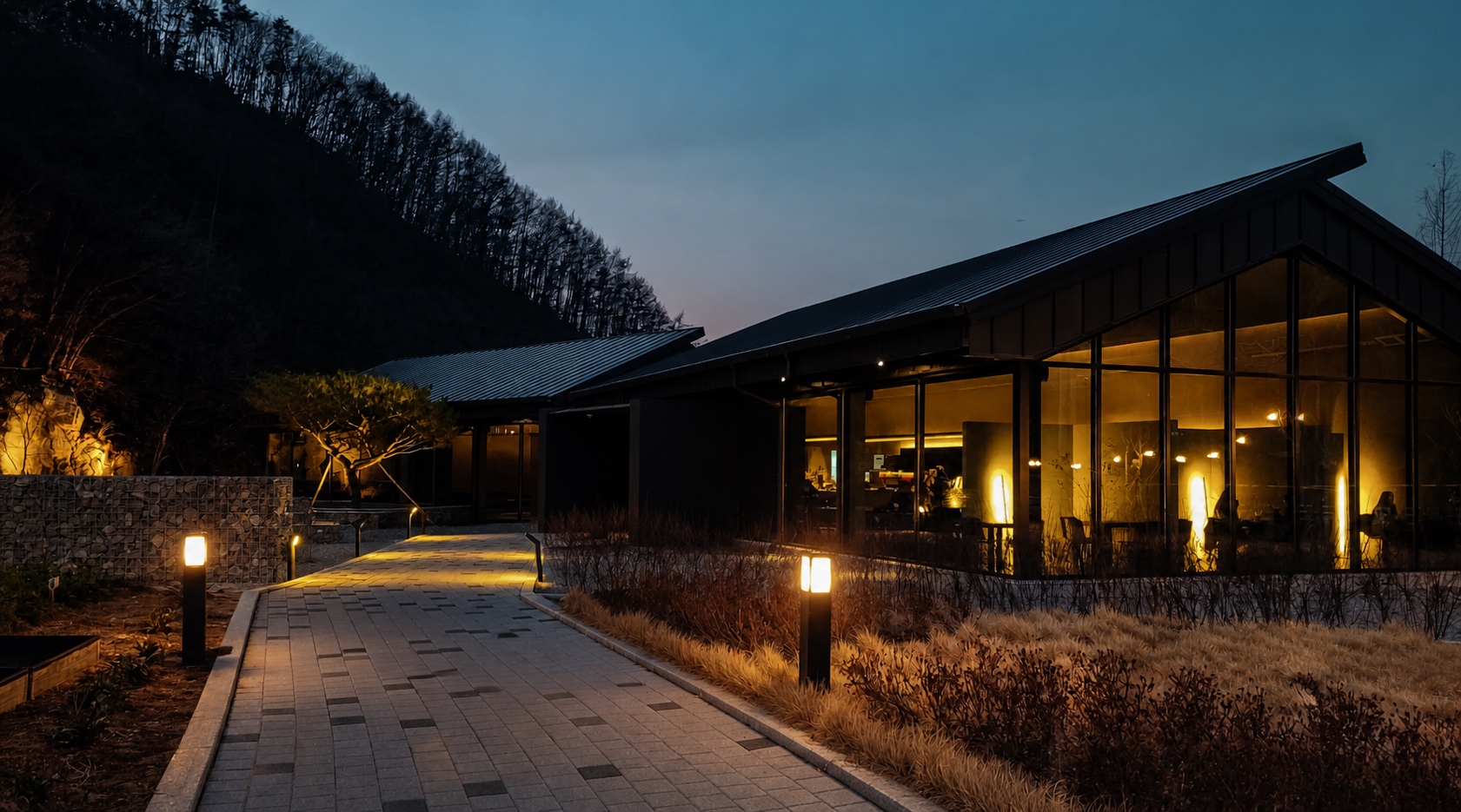 Contemporary pavilion illuminated at dusk